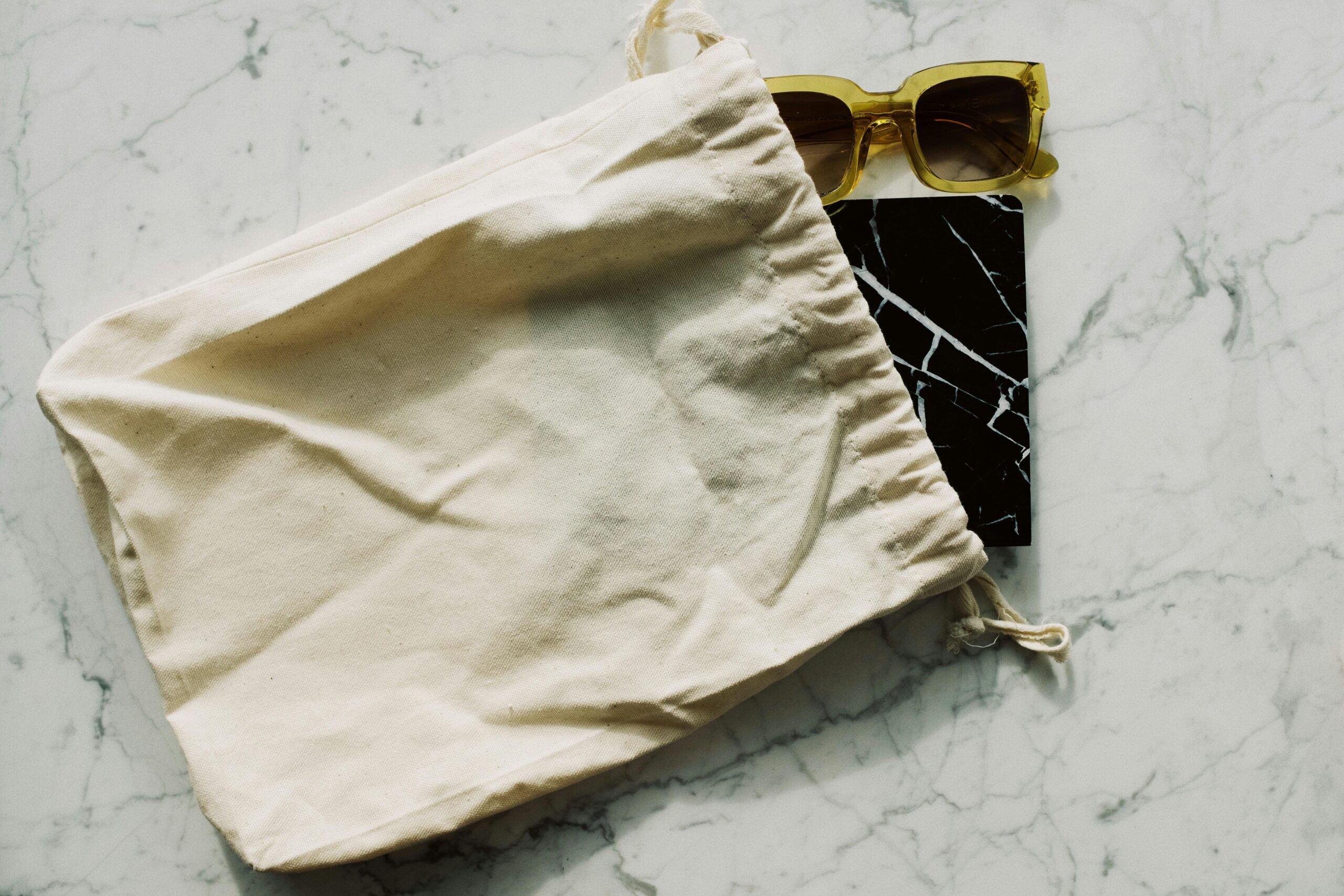 Comparison between organic cotton pads and synthetic pads showing visible differences in texture and composition