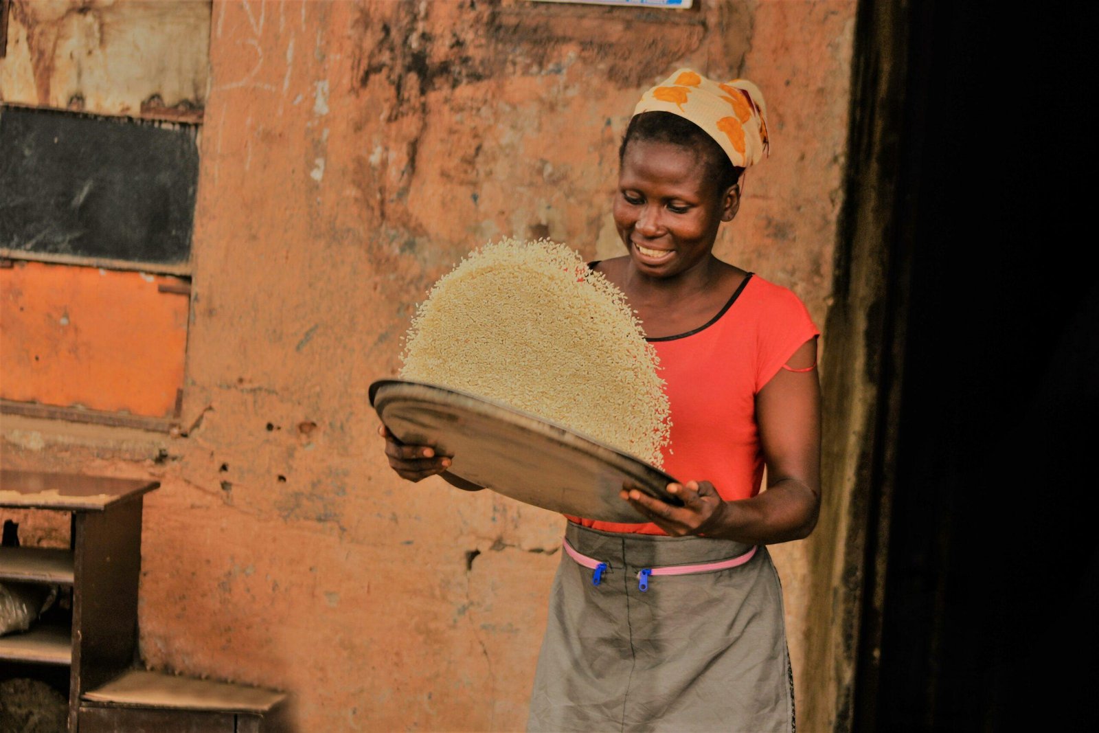 Two smiling women holding boxes of organic sanitary pads