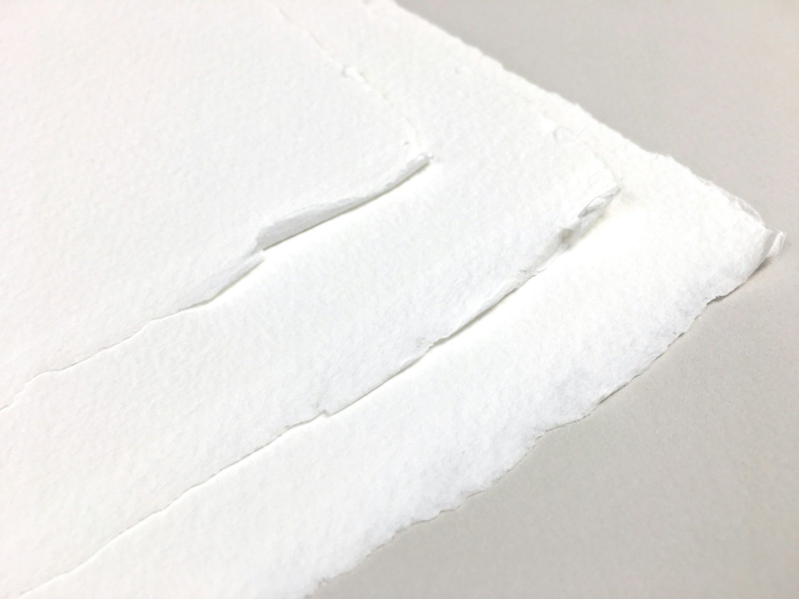 a piece of white paper with a hole in it