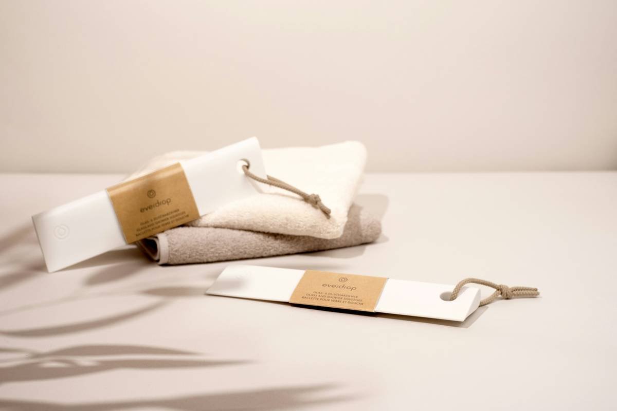 a towel and a bottle of lotion sitting on a table