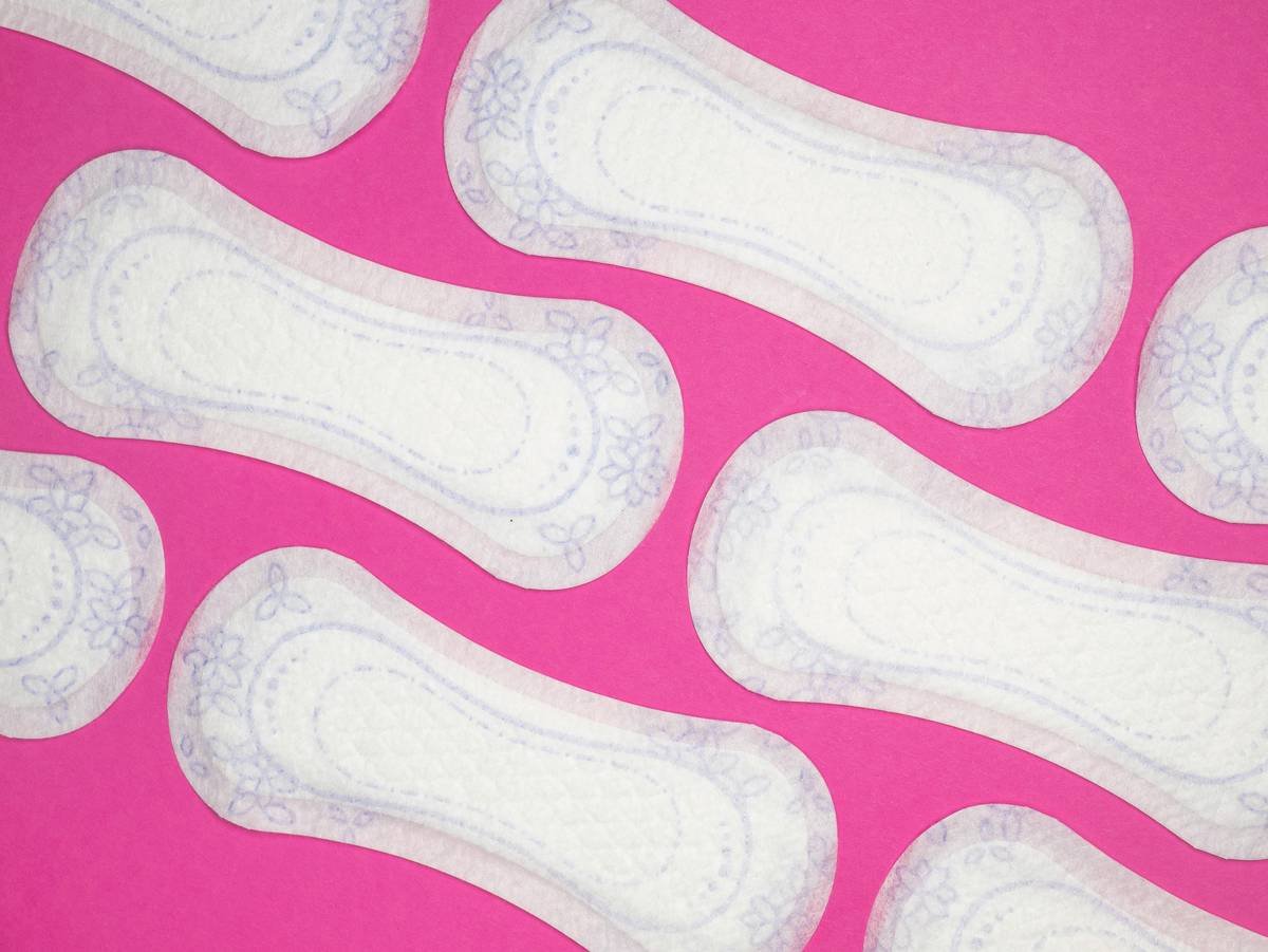 Menstrual health products and supplies (pads, tampons, menstrual cups or reusable cups) on a colorful background.