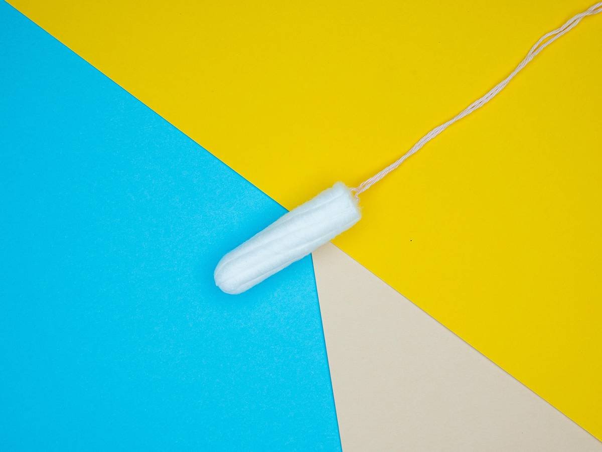 a white object on a yellow and blue background