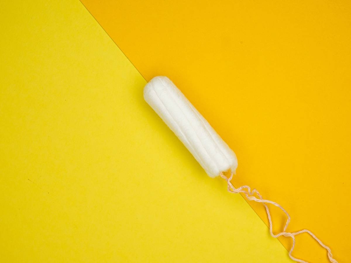 a white toothbrush on a yellow and yellow background