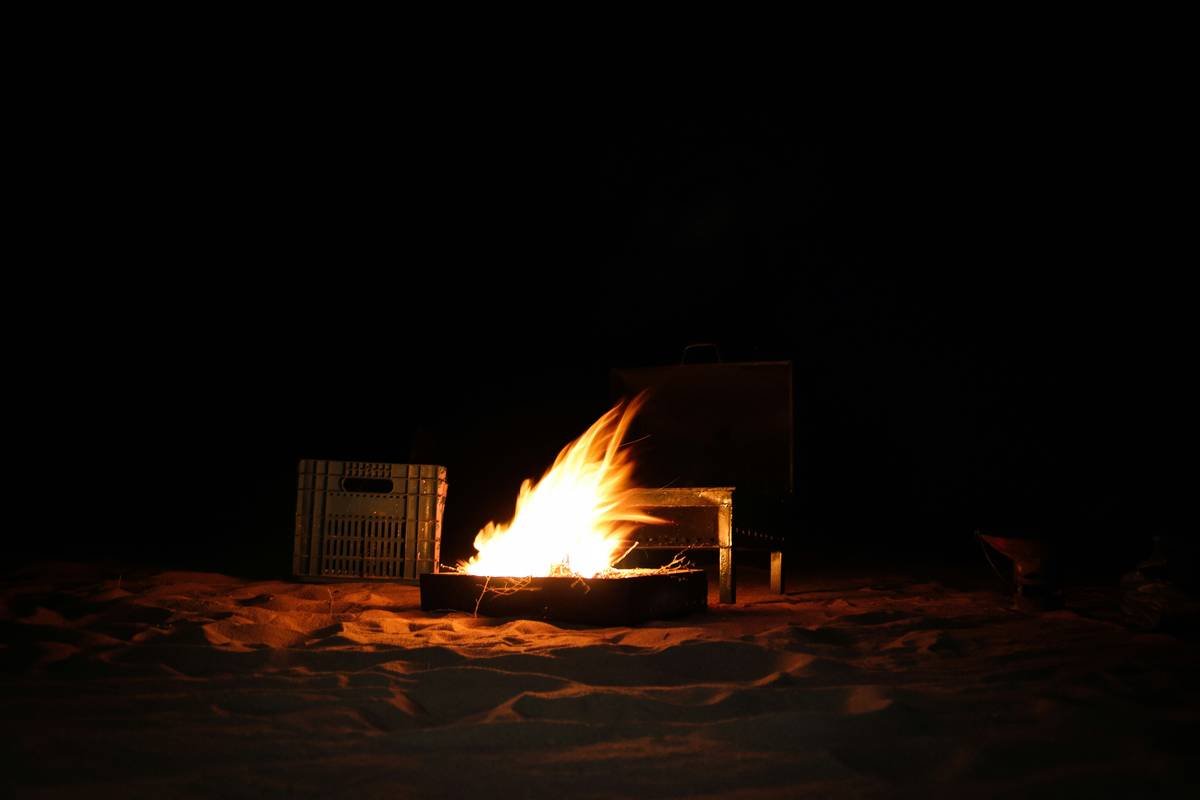 Lighting up a fire in the middle of the Adrar desert.