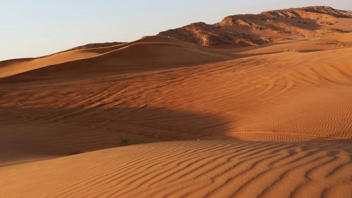 San dune bashing and natural rock erosion in Dubai