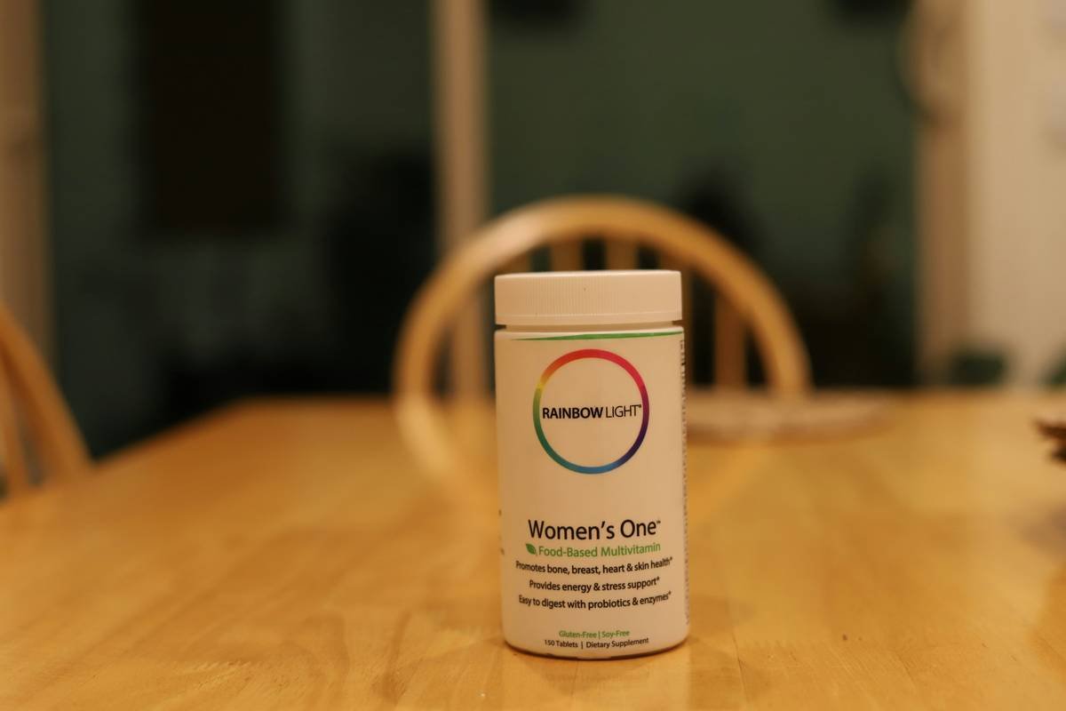 Woman holding organic natural pad hygiene products with GOTS certification labels visible